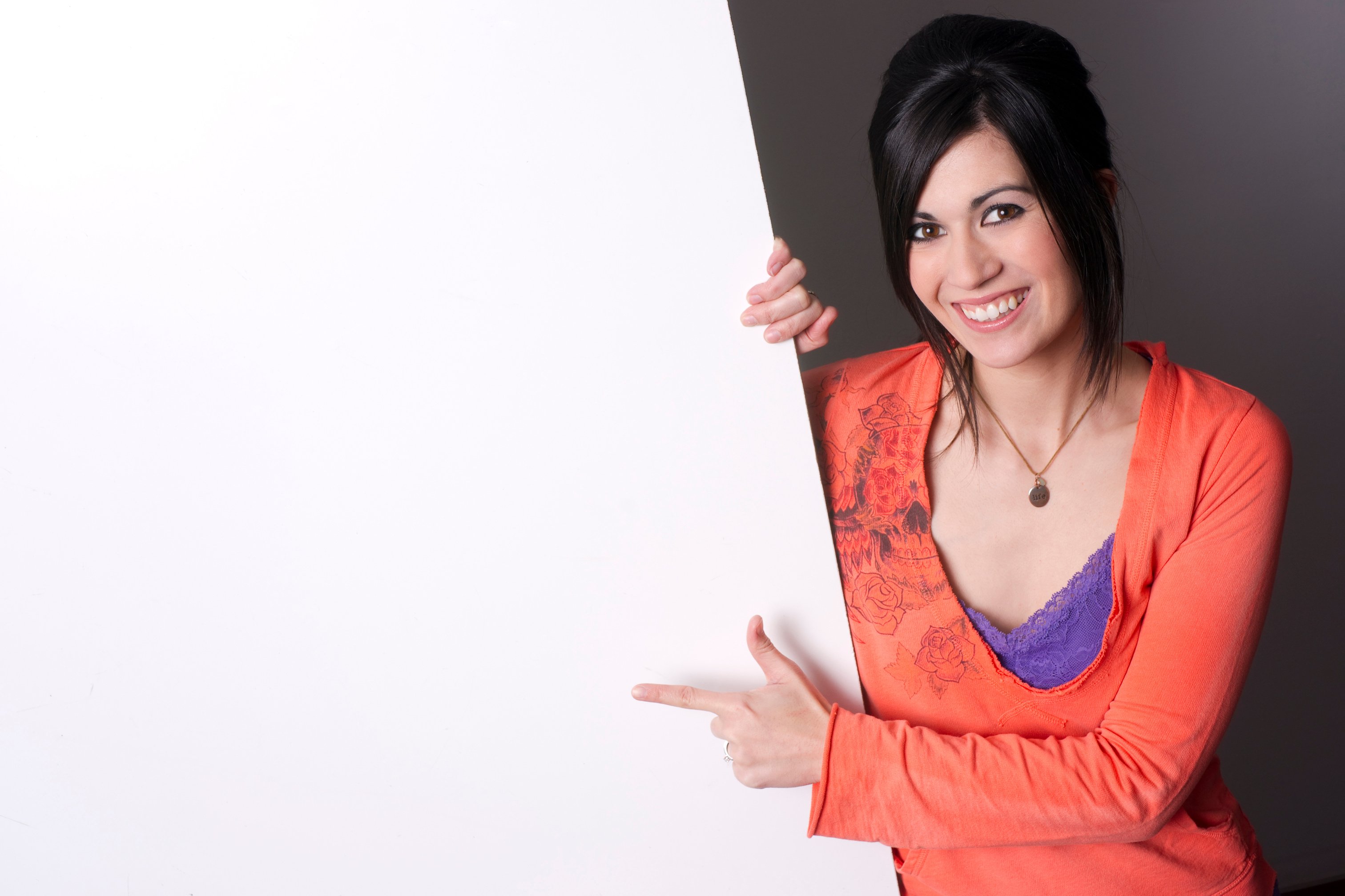 Woman Pointing at Wall